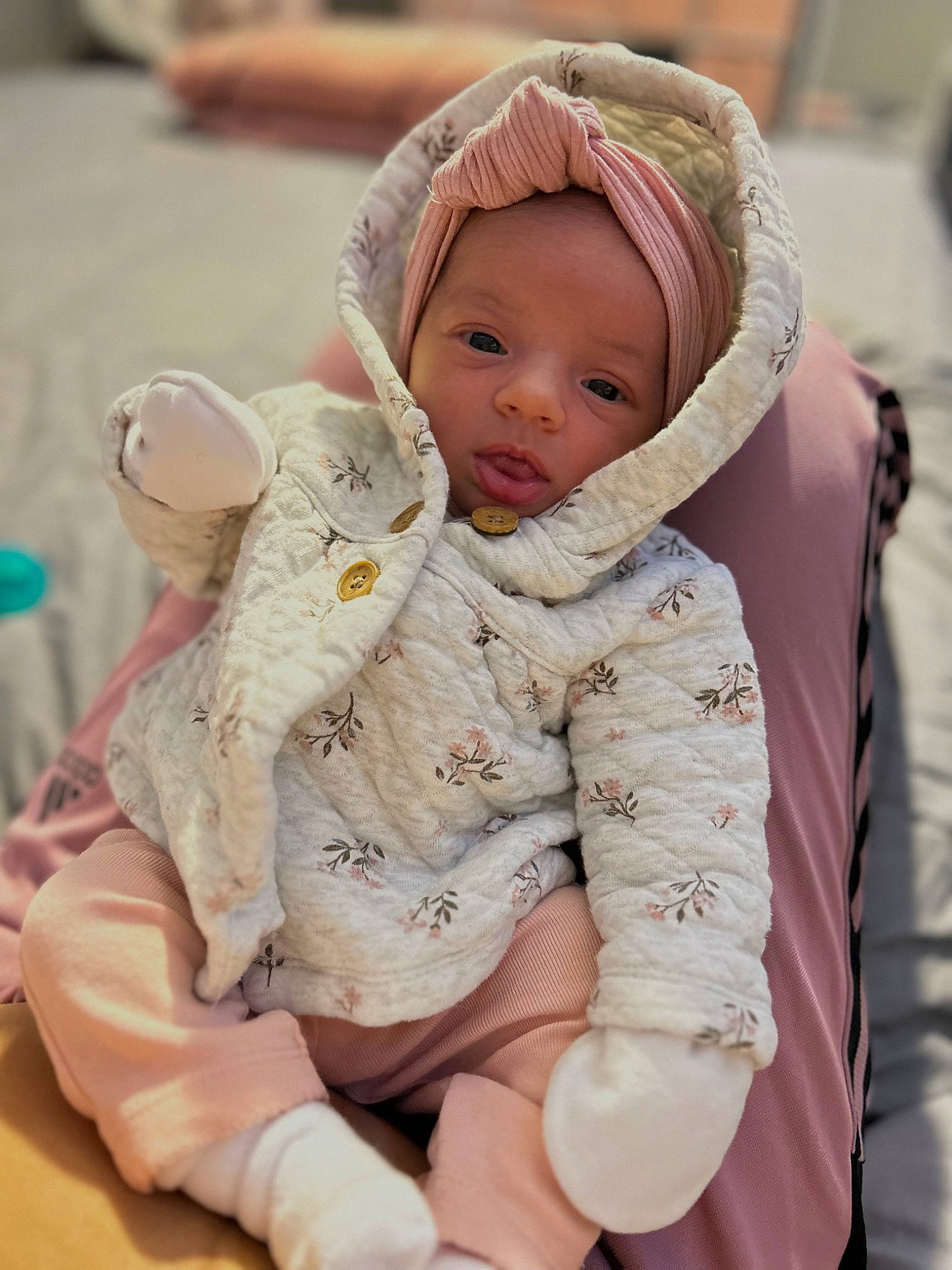 Leilani joined the competition — help win amazing prizes! baby, baby_sleeping, baby_toddler_clothing, cap, cheek, child, comfort, fun, fur, happy, hat, headwear, linens, outerwear, person, pink, sitting, skin, sleeve, textile