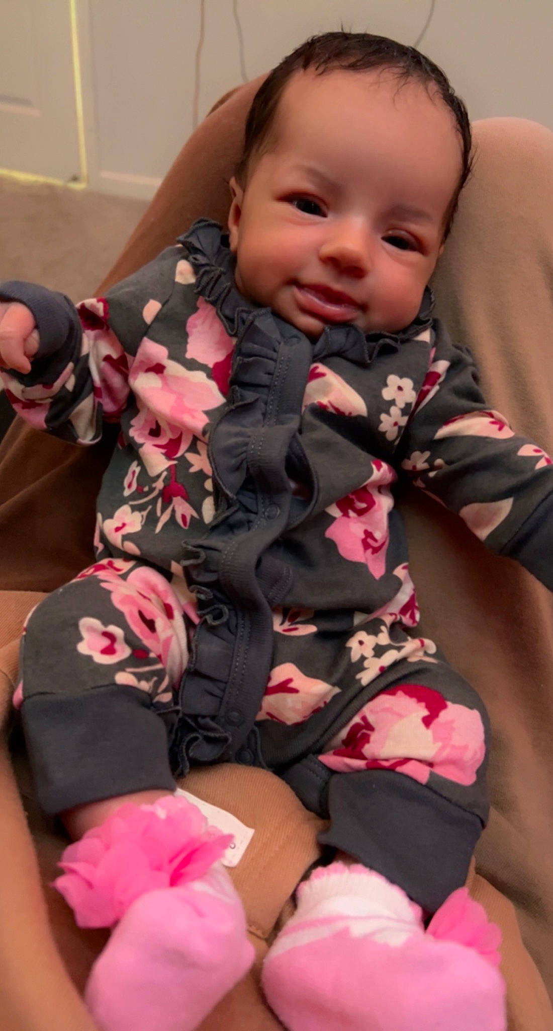 Leilani is registered to the contest to win money with this photo: baby, baby_products, baby_toddler_clothing, cheek, child, comfort, finger, human_leg, knee, nail, pattern, person, pink, sitting, skin, sleeve, smile, sock, thigh, thumb