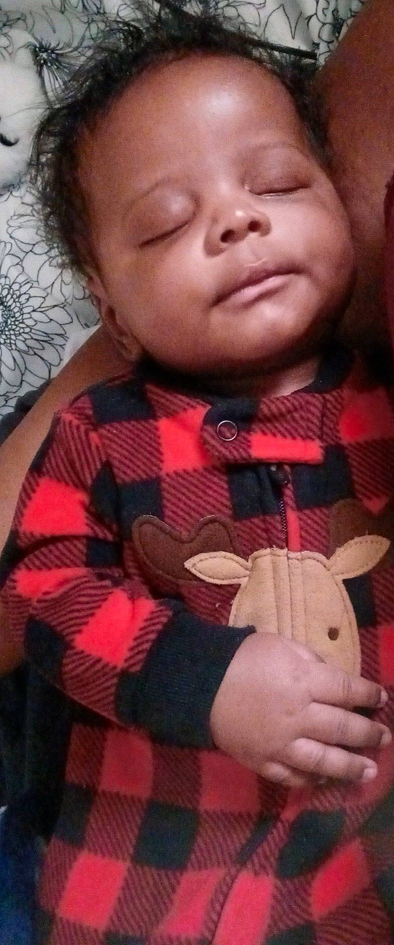 Xavion is registered to the contest to win money with this photo: baby_toddler_clothing, cheek, chin, eyebrow, eyelash, facial_expression, finger, guitar_accessory, hand, lip, mouth, musical_instrument, neck, nose, person, pink, plaid, skin, sleeve, textile