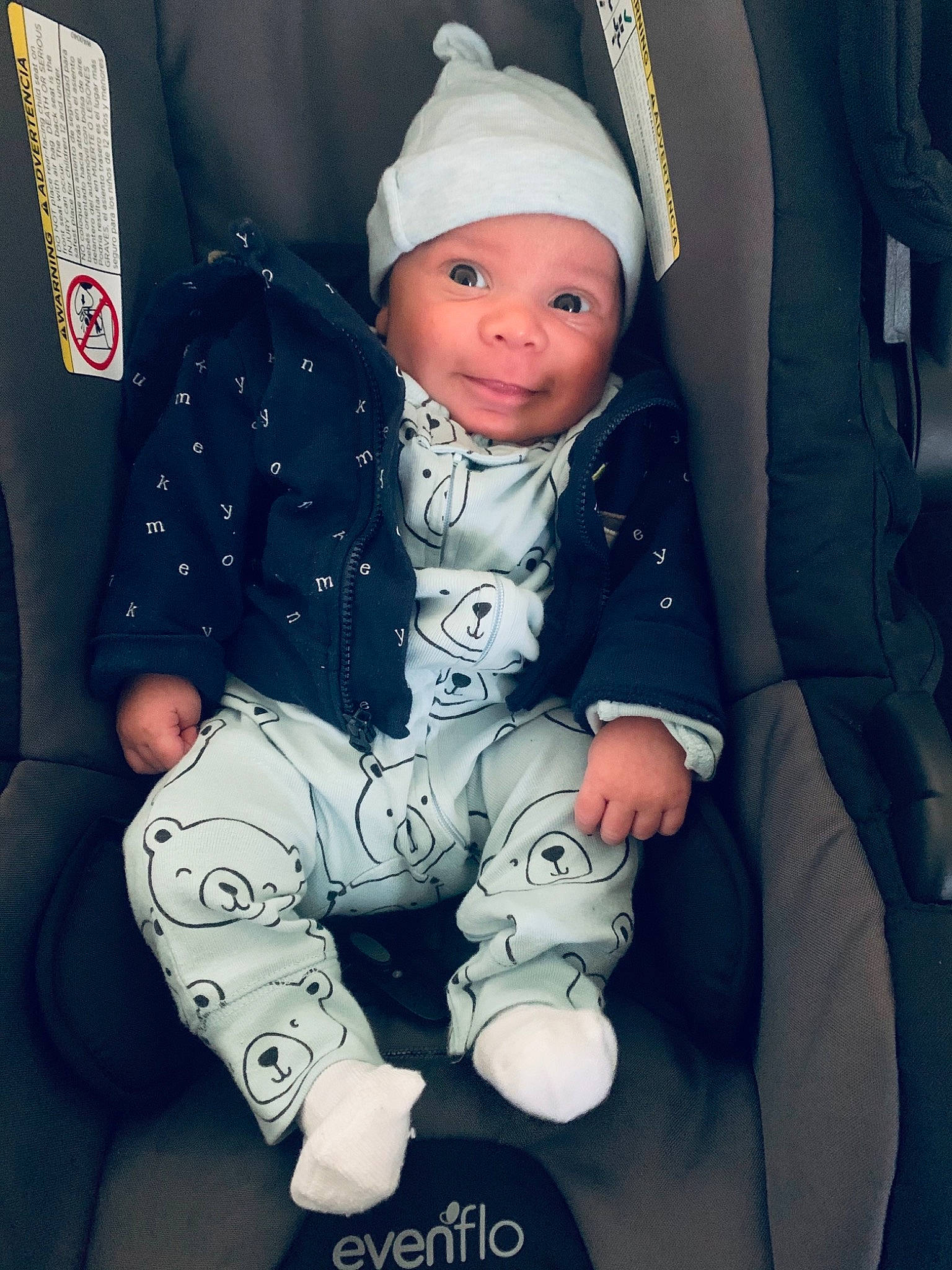 Enzo joined the competition — help win amazing prizes! baby, baby_carriage, baby_toddler_clothing, beauty, cap, cheek, child, comfort, cool, facial_expression, happy, headwear, lap, mammal, person, photograph, product, sleeve, smile, textile