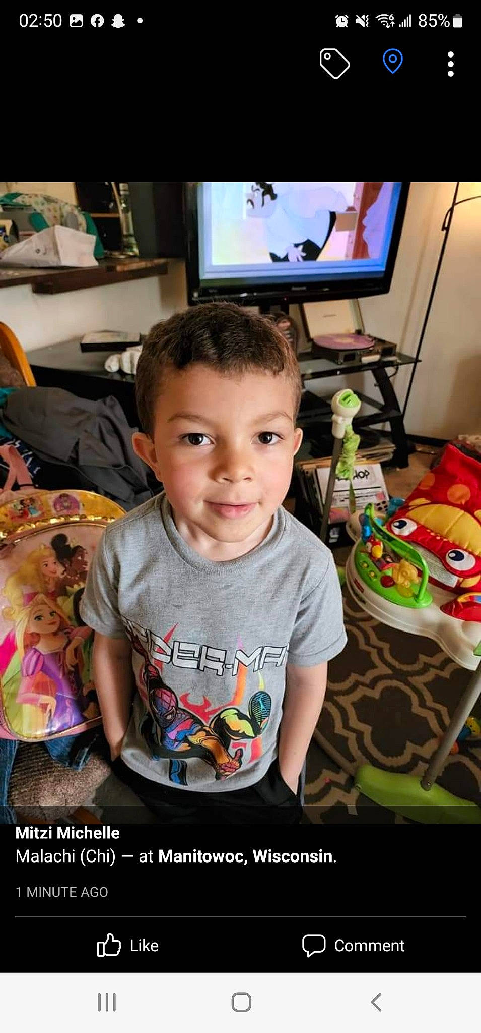 Malachi joined the competition — help win amazing prizes! child, display_device, electronic_device, event, fun, gadget, happy, home_appliance, joy, led_backlit_lcd_display, living_room, people, person, play, room, sitting, sleeve, smile, t_shirt, television