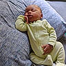 Willow is registered to the contest to win money with this photo: baby, sleeping, onesie, pillow, hand, face, infant, peaceful, resting, cute, child, indoor, soft, cozy, newborn, portrait, relaxed, lying_down, bed, blanket