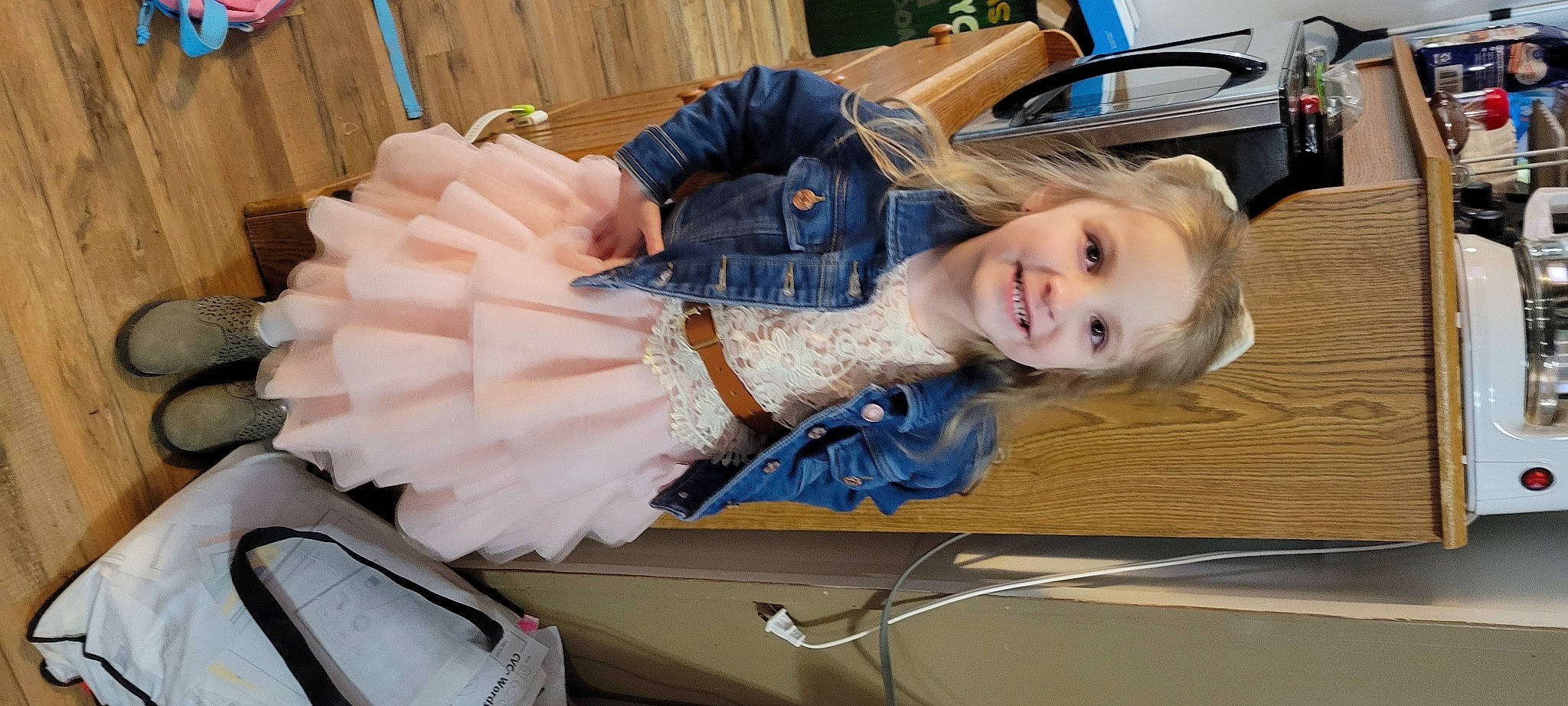 Eve joined the competition — help win amazing prizes! auto_part, automotive_design, automotive_exterior, bumper, child, electric_blue, fun, fur, glove, hood, joy, luxury_vehicle, motor_vehicle, person, sitting, smile, toddler, vehicle_door, wood