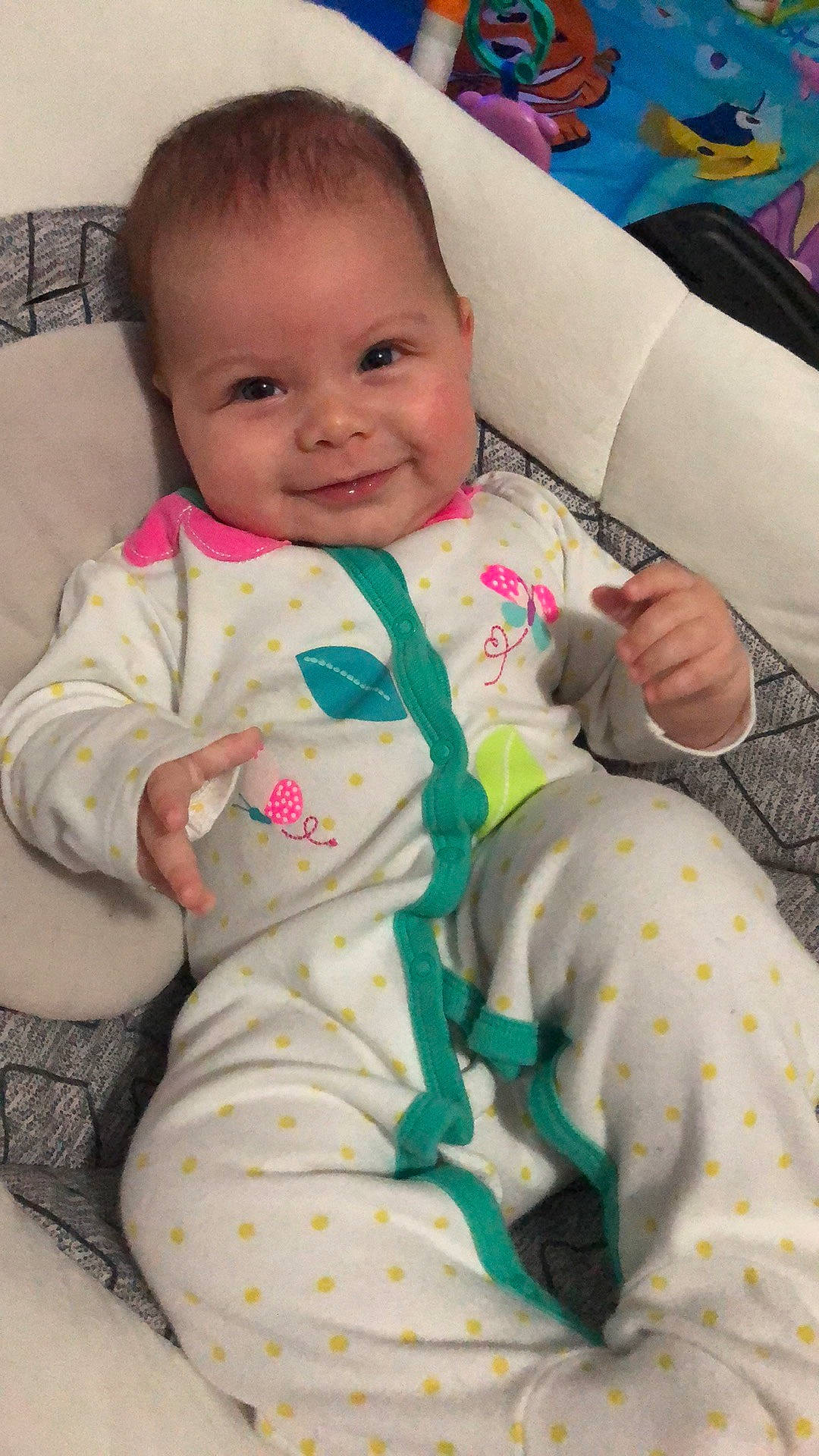 Wren is registered to the contest to win money with this photo: baby, baby_products, baby_toddler_clothing, cheek, child, comfort, face, hand, human, human_body, joy, lap, linens, mouth, nose, office_equipment, person, pink, product, sitting