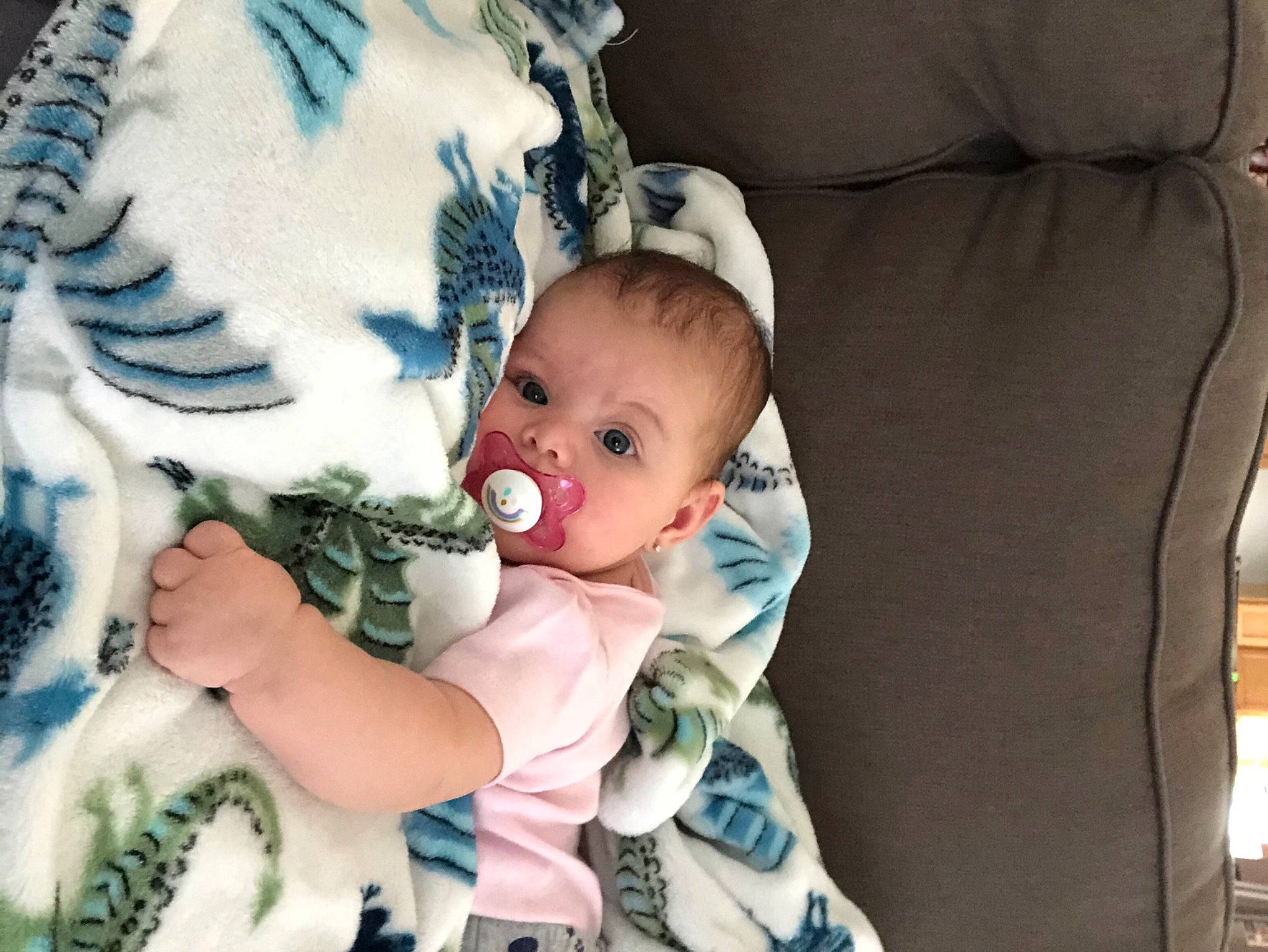 Wren is registered to the contest to win money with this photo: baby, baby_products, baby_toddler_clothing, linens, living_room, person, textile, turquoise
