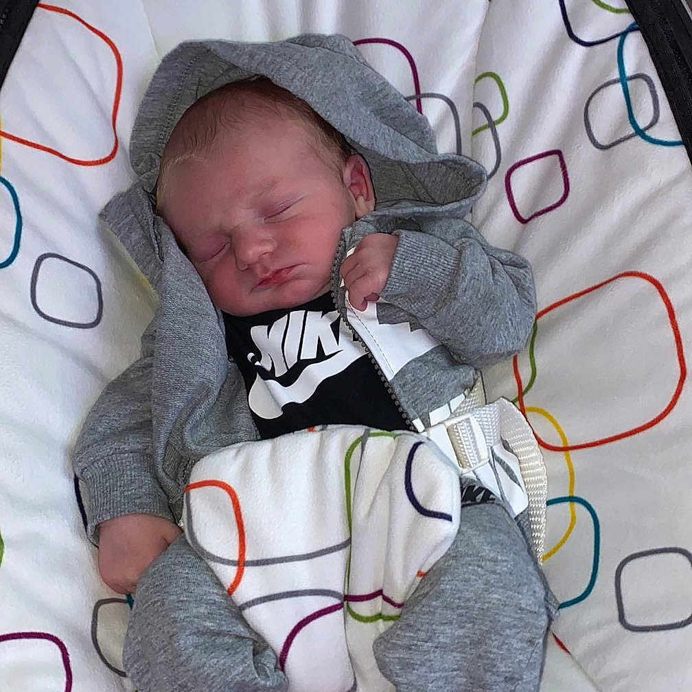 Alexander is registered to the contest to win money with this photo: baby, bed, blanket, clothing, crib, cushion, face, furniture, glove, hat, head, homedecor, infantbed, knitwear, newborn, person, photography, portrait, quilt, sleeping