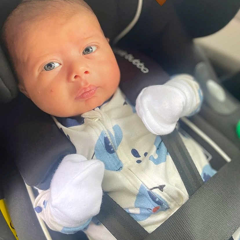 Cadet joined the competition — help win amazing prizes! baby, blue_eyes, car_interior, car_seat, child, closeup, cute, expression, face, heart_emoji, indoor, infant, mittens, newborn, onesie, portrait, safety, seat, seatbelt, straps