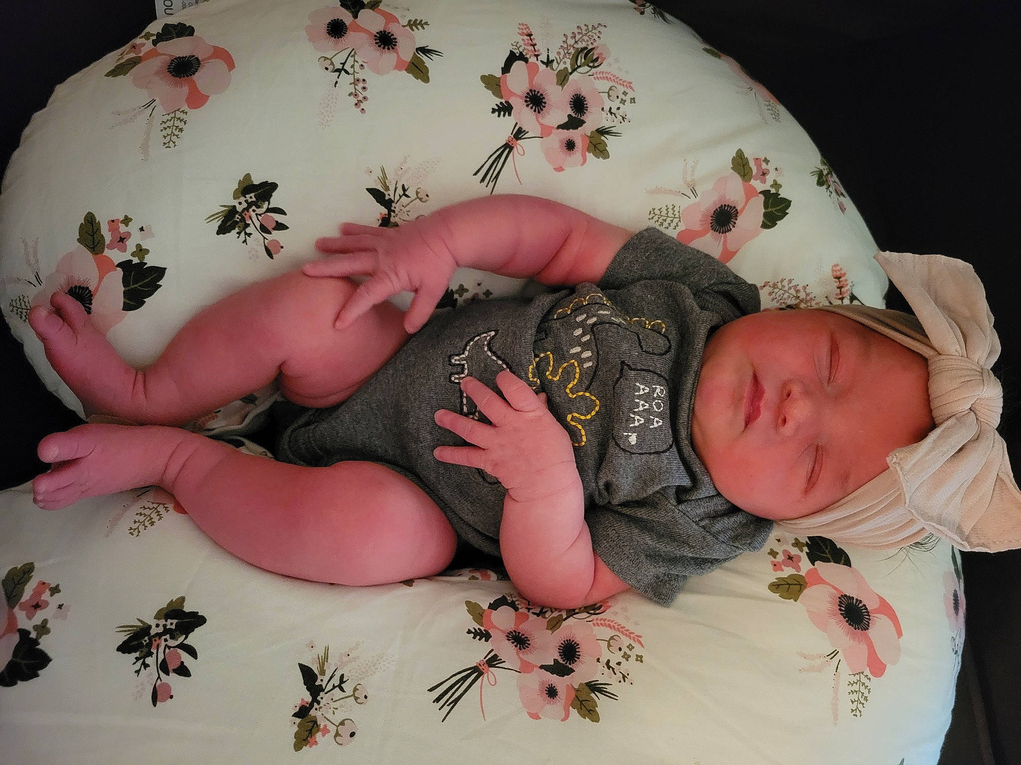 Annabeth is registered to the contest to win money with this photo: arm, baby, baby_products, baby_sleeping, baby_toddler_clothing, child, comfort, fashion_accessory, finger, headband, headgear, headwear, human_body, human_leg, pattern, person, pink, sitting, skin, sleeve