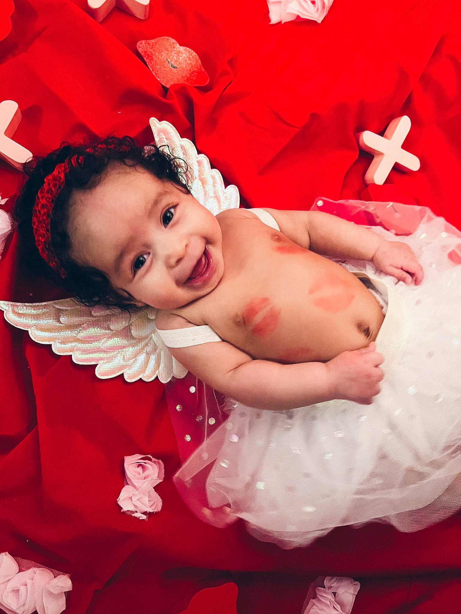 Emberlynn is registered to the contest to win money with this photo: arm, baby, baby_toddler_clothing, child, comfort, event, finger, flash_photography, fun, gesture, happy, joy, magenta, peach, person, petal, pink, red, skin, smile