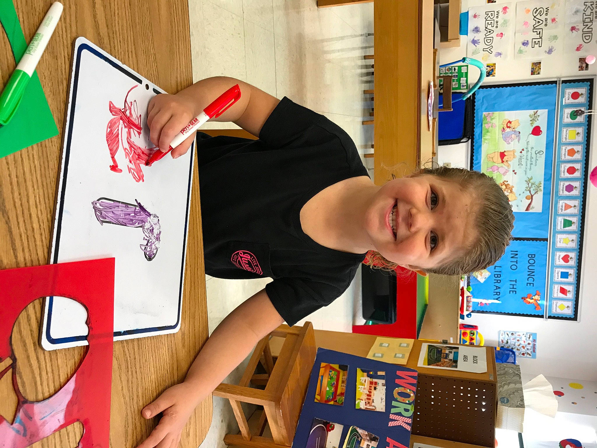 Julie joined the competition — help win amazing prizes! art, artist, bookcase, child, flooring, fun, happy, hardwood, joy, learning, pattern, person, play, room, shelf, shelving, smile, t_shirt, toddler, visual_arts