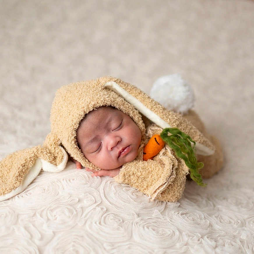 Izzy is registered to the contest to win money with this photo: baby, sleeping, costume, bunny, carrot, soft_texture, blanket, cute, infant, child, adorable, resting, cozy, fabric, headwear, sleep, portrait, animal_costume, newborn, peaceful