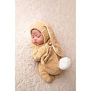 Izzy is registered to the contest to win money with this photo: baby, sleeping, costume, bunny, ears, tail, fuzzy, soft, blanket, texture, cute, infant, child, adorable, resting, portrait, indoors, newborn, peaceful, cozy