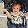Leo joined the competition — help win amazing prizes! child, toddler, stroller, smiling, outdoor, pavement, canopy, shirt, shorts, person, happy, baby, seatbelt, people, daytime, clothing, cute, expression, park, holding