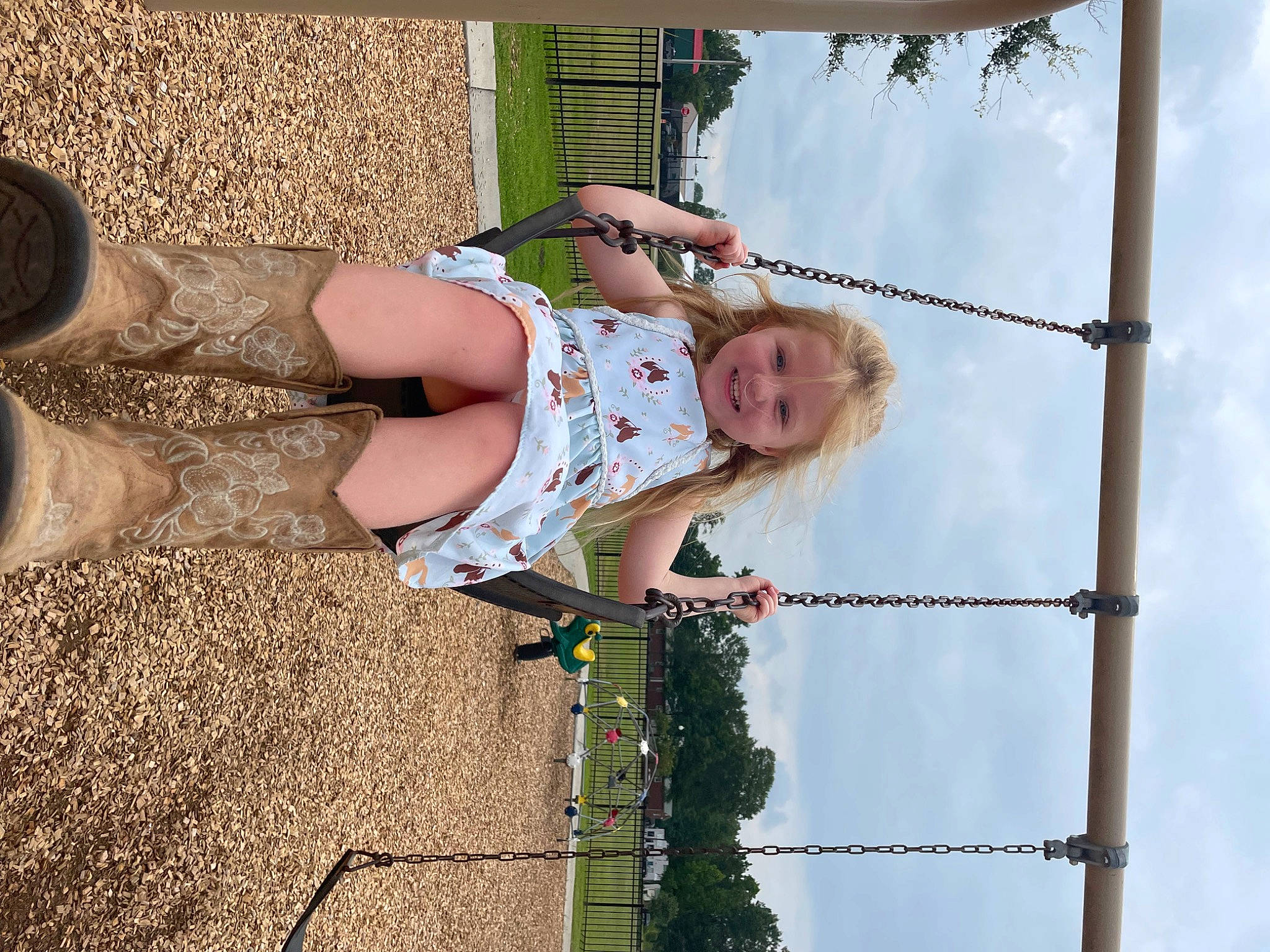 Harper is registered to the contest to win money with this photo: cloud, fun, grass, green, happy, human_leg, joy, leisure, line, people_in_nature, person, photography, plant, sky, smile, tree, vacation, waist, wire_fencing