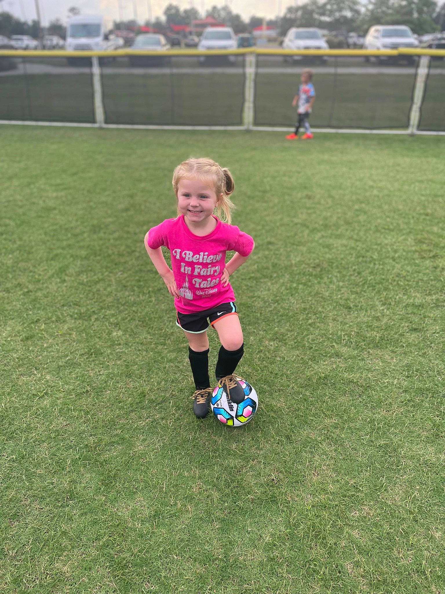 Harper is registered to the contest to win money with this photo: ball, ball_game, competition_event, football, football_equipment, football_player, grass, joy, person, player, playing_sports, recreation, shorts, soccer, soccer_ball, soccer_player, sports, sports_equipment, sportswear, t_shirt
