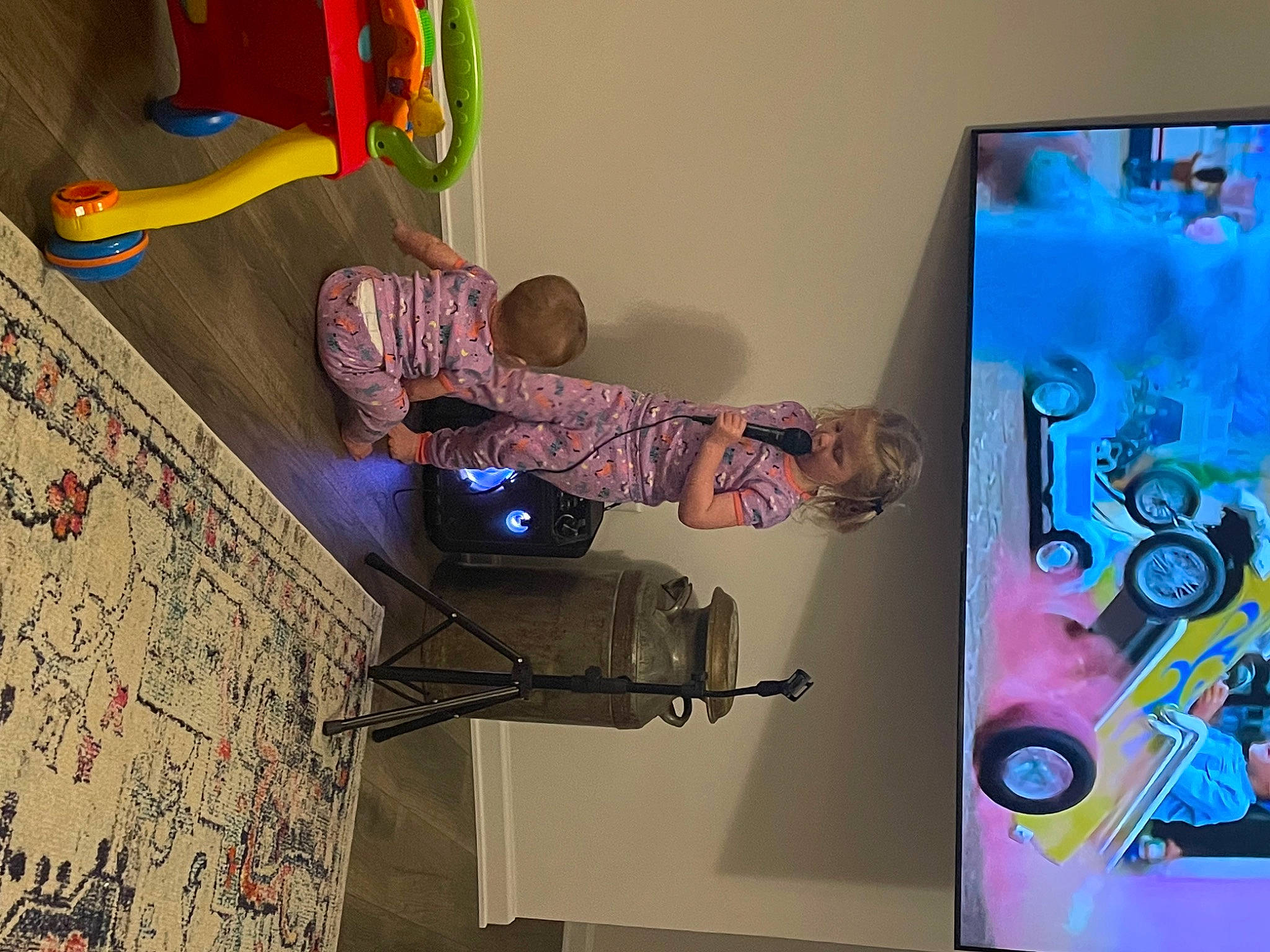 Harper is registered to the contest to win money with this photo: art, artist, display_device, event, font, fun, graphic_design, graphics, machine, magenta, multimedia, person, purple, room, space, television_set, visual_arts, wall