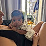Ellie participe au concours pour gagner de l'argent avec cette photo : adult, baby, balcony, clothing, curtains, face, furniture, hair, hand, holding, indoor, infant, legs, light, person, relaxation, resting, shadow, skin, window