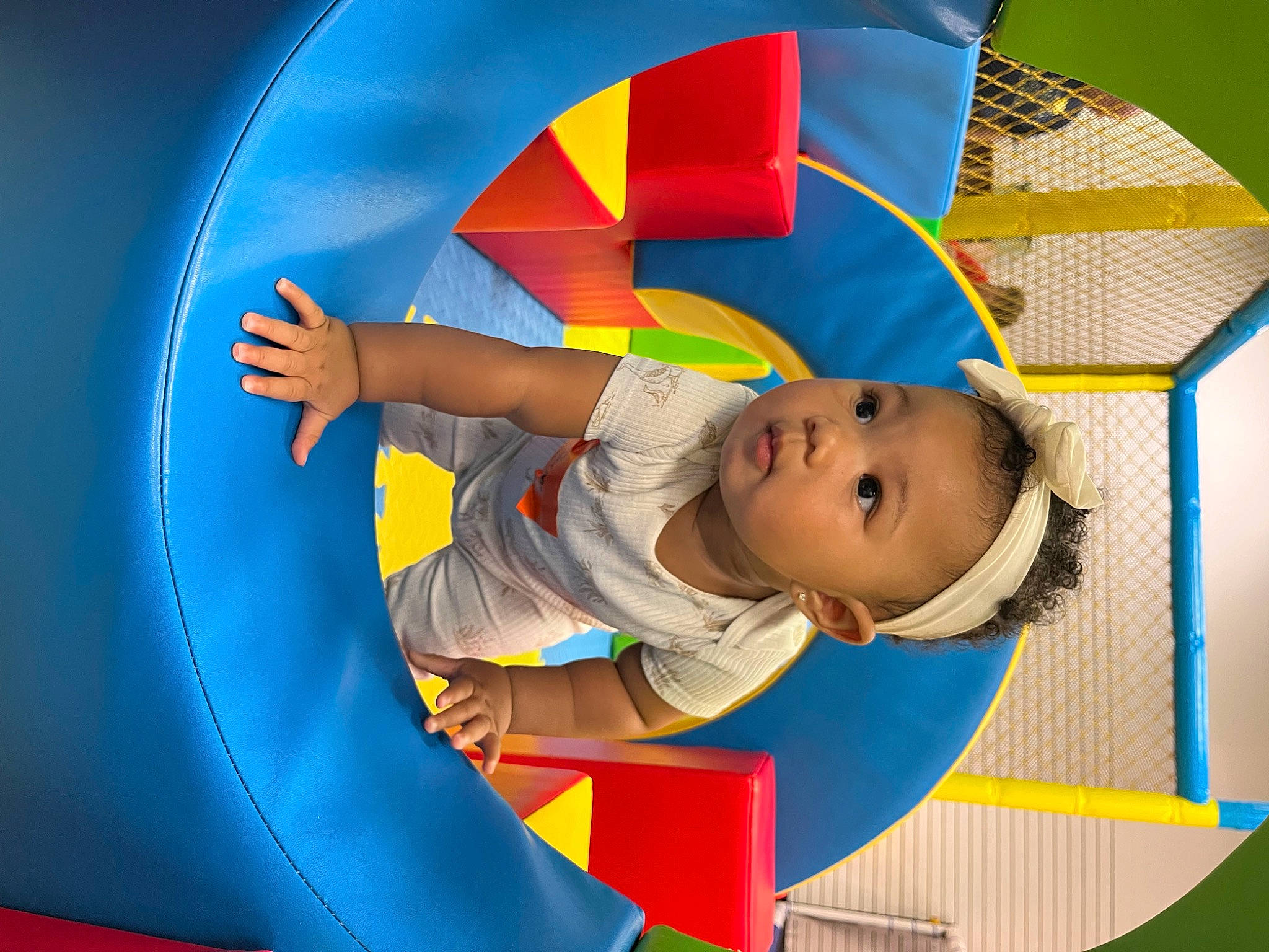Blu is registered to the contest to win money with this photo: baby, baby_products, baby_toys, child, circle, comfort, electric_blue, fashion_accessory, fun, happy, illustration, leisure, outdoor_play_equipment, pattern, person, play, recreation, sitting, symmetry, toddler
