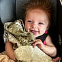 Ruby joined the competition — help win amazing prizes! baby, smiling, car_seat, blanket, happy, infant, child, person, hair, clothing, seatbelt, cute, face, portrait, indoor, comfort, hand, skin, expression, closeup