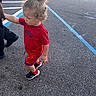 Legend joined the competition — help win amazing prizes! child, toddler, curly_hair, red_clothing, walking, holding_hand, adult, asphalt, parking_lot, shopping_cart, side_view, casual, outdoor, footwear, person, street, daylight, motion, human, urban