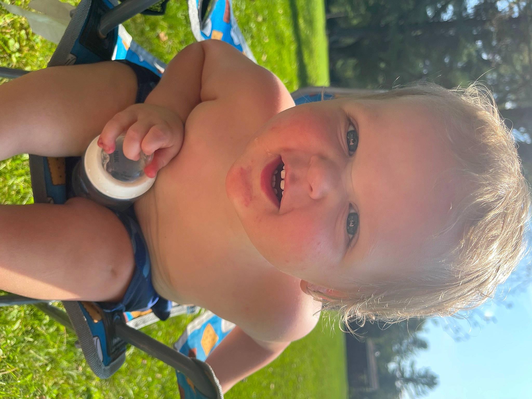 Fabian is registered to the contest to win money with this photo: cheek, cool, daytime, fun, grass, happy, head, leaf, leisure, light, lip, mouth, nose, people_in_nature, person, photograph, skin, smile, sunlight, toddler