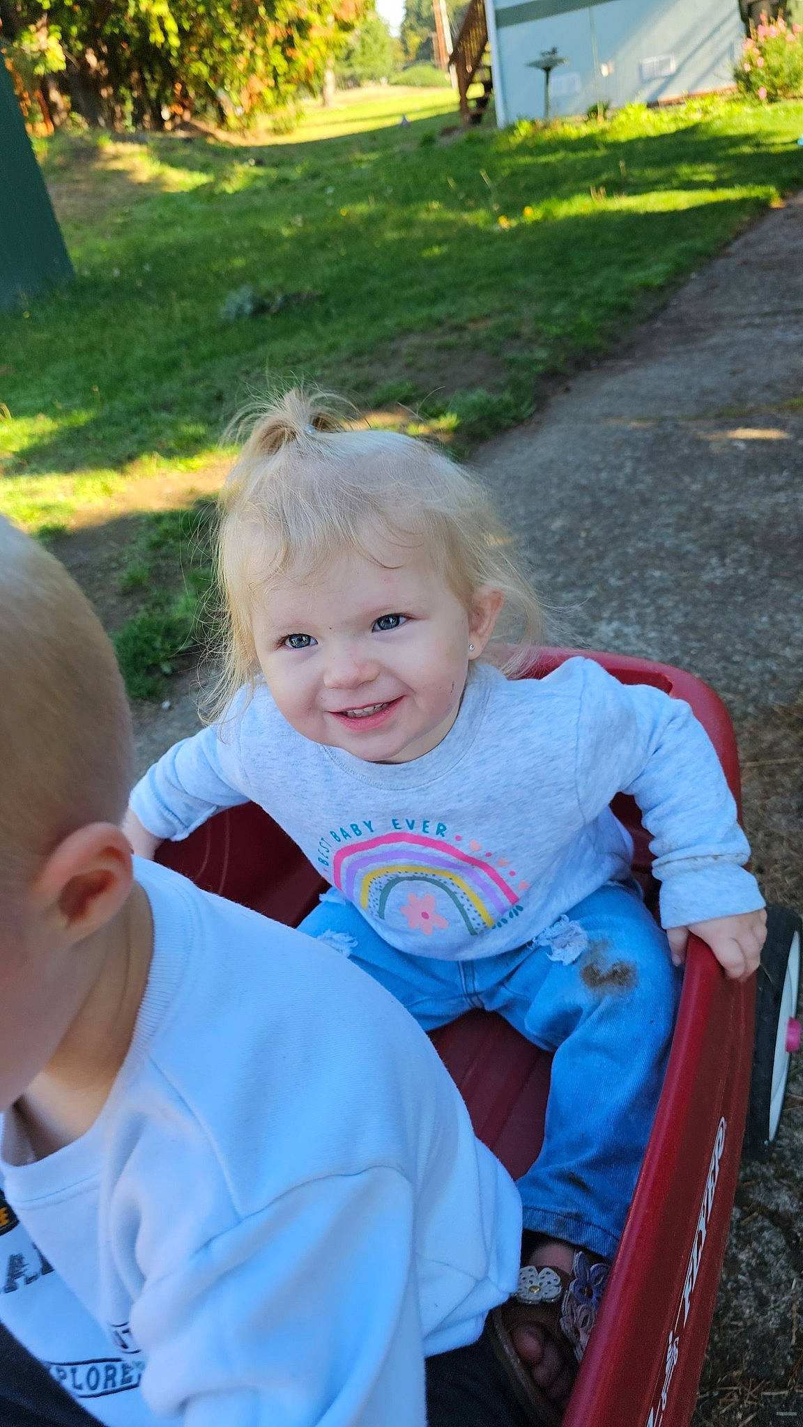 Riverlynn is registered to the contest to win money with this photo: electric_blue, event, facial_expression, fun, grass, happy, head, iris, joy, lawn, leaf, leisure, people_in_nature, person, plant, recreation, sitting, skin, smile, summer