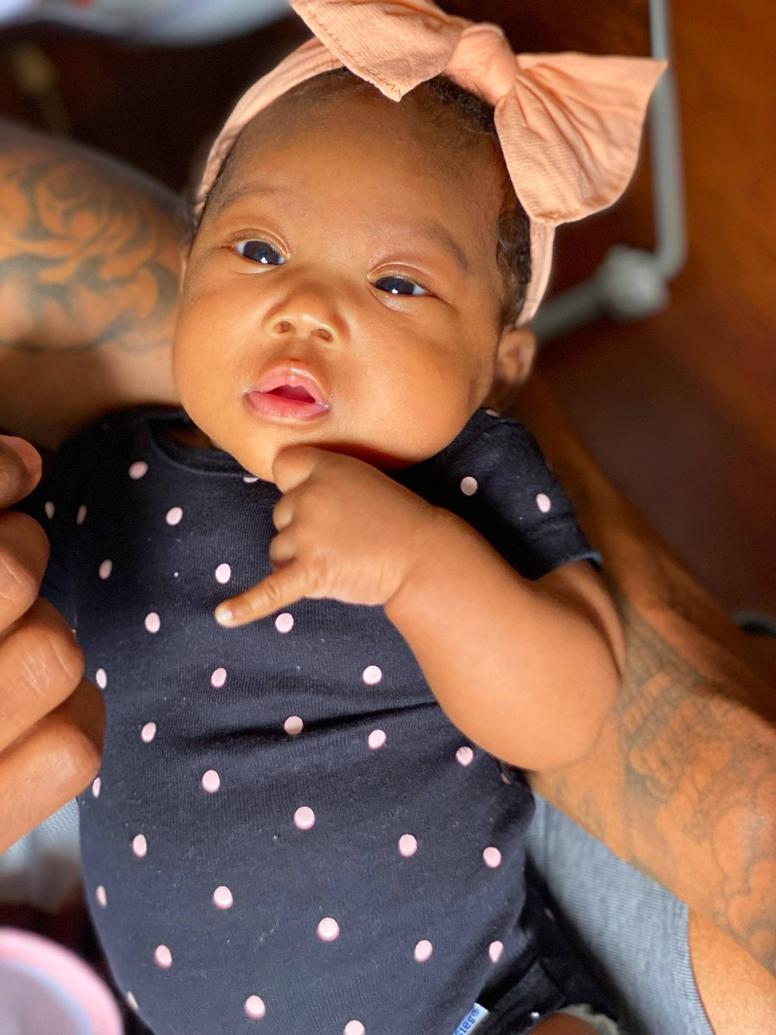Kamiyah is registered to the contest to win money with this photo: baby, baby_toddler_clothing, cheek, eye, face, facial_expression, finger, gesture, hairstyle, hand, happy, head, lip, mouth, nose, person, skin, sleeve, standing, thumb