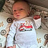 Dakota joined the competition — help win amazing prizes! baby, infant, onesie, crib, blanket, pattern, red_truck, farm_animals, soft_lighting, cute, calm, curious, clothing, child, indoor, person, newborn, resting, lying_down, bedtime