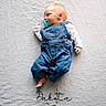 baby, sleeping, pacifier, denim_overalls, white_blanket, textured_blanket, infant, cute, resting, child, portrait, peaceful, soft_lighting, indoors, cozy, small_hands, small_feet, name_embroidery, calm, sleep