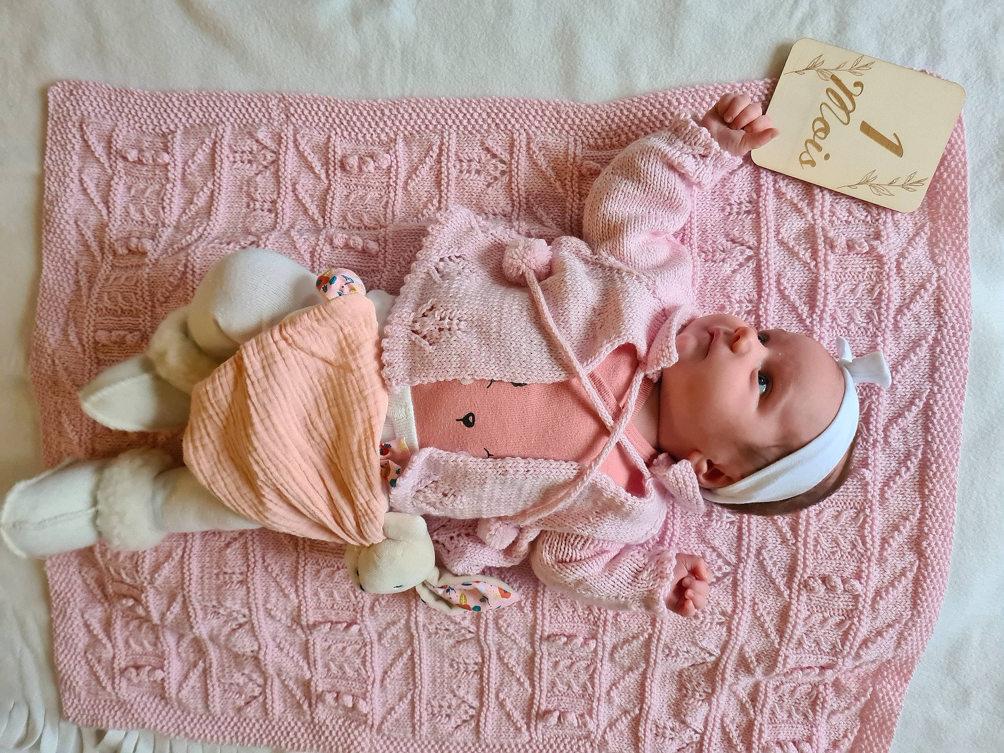 Lana participe au concours pour gagner de l'argent avec cette photo : baby, baby_toddler_clothing, beige, child, craft, dress, fashion_accessory, fur, hand, hat, headgear, headwear, jewellery, linens, pattern, peach, person, pink, sleeve, tableware