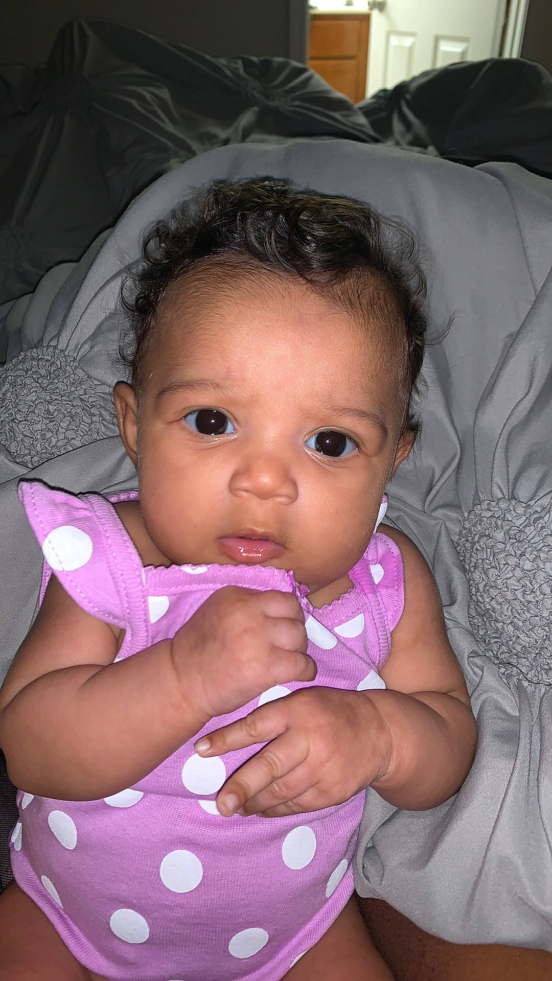 Nova is registered to the contest to win money with this photo: baby, baby_products, black_hair, cheek, child, eye, face, finger, head, iris, lip, mouth, neck, nose, person, pink, product, skin, toddler