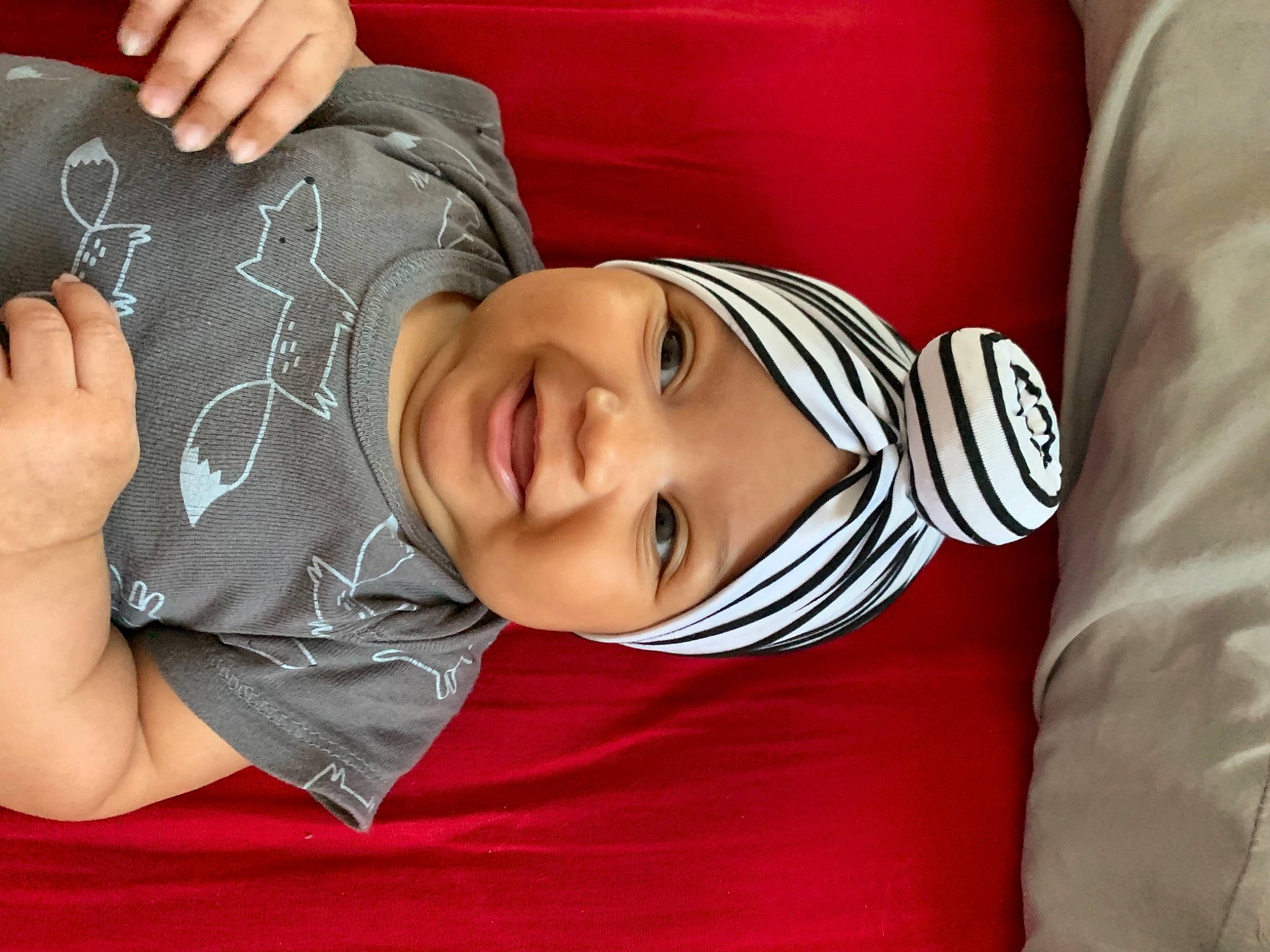 Nova is registered to the contest to win money with this photo: arm, cheek, child, ear, elbow, gesture, hand, head, headwear, joy, linens, mouth, nap, neck, person, sleep