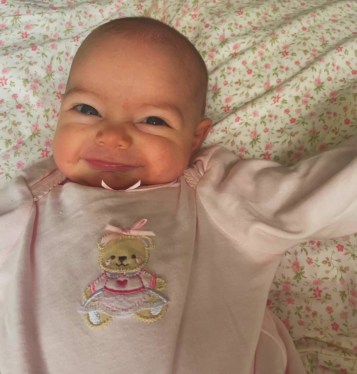 Winona is registered to the contest to win money with this photo: baby, baby_products, baby_safety, baby_sleeping, baby_toddler_clothing, bib, cheek, child, comfort, face, happy, linens, nose, pattern, person, skin, sleeve, t_shirt, textile, toddler