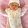 baby, sleeping, onesie, hat, pink_blanket, infant, cute, animal_print, soft_texture, peaceful, portrait, child, newborn, clothing, cozy, indoors, resting, headwear, cute_outfit, sleep