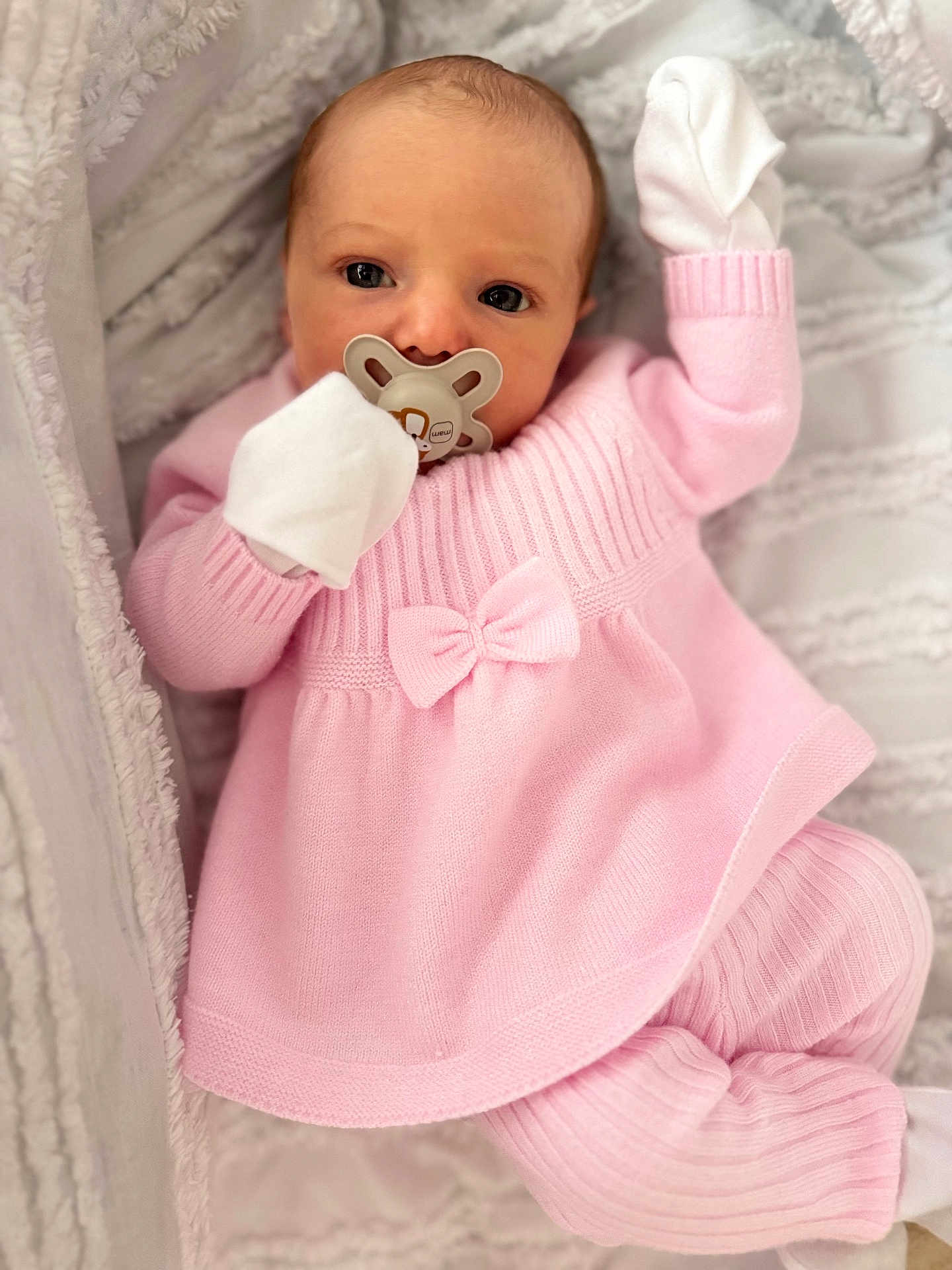 Gracie joined the competition — help win amazing prizes! baby, infant, pacifier, pink_clothing, mittens, blanket, cozy, soft_texture, newborn, cute, sleepwear, portrait, lying_down, indoors, child, face, hand, expression, warm, rest