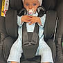 baby, car_seat, pacifier, headband, bow, blue_eyes, knitted_outfit, booties, infant, child, seat_belt, black_seat, cute, portrait, indoors, hands, feet, child_safety, baby_fashion, closeup