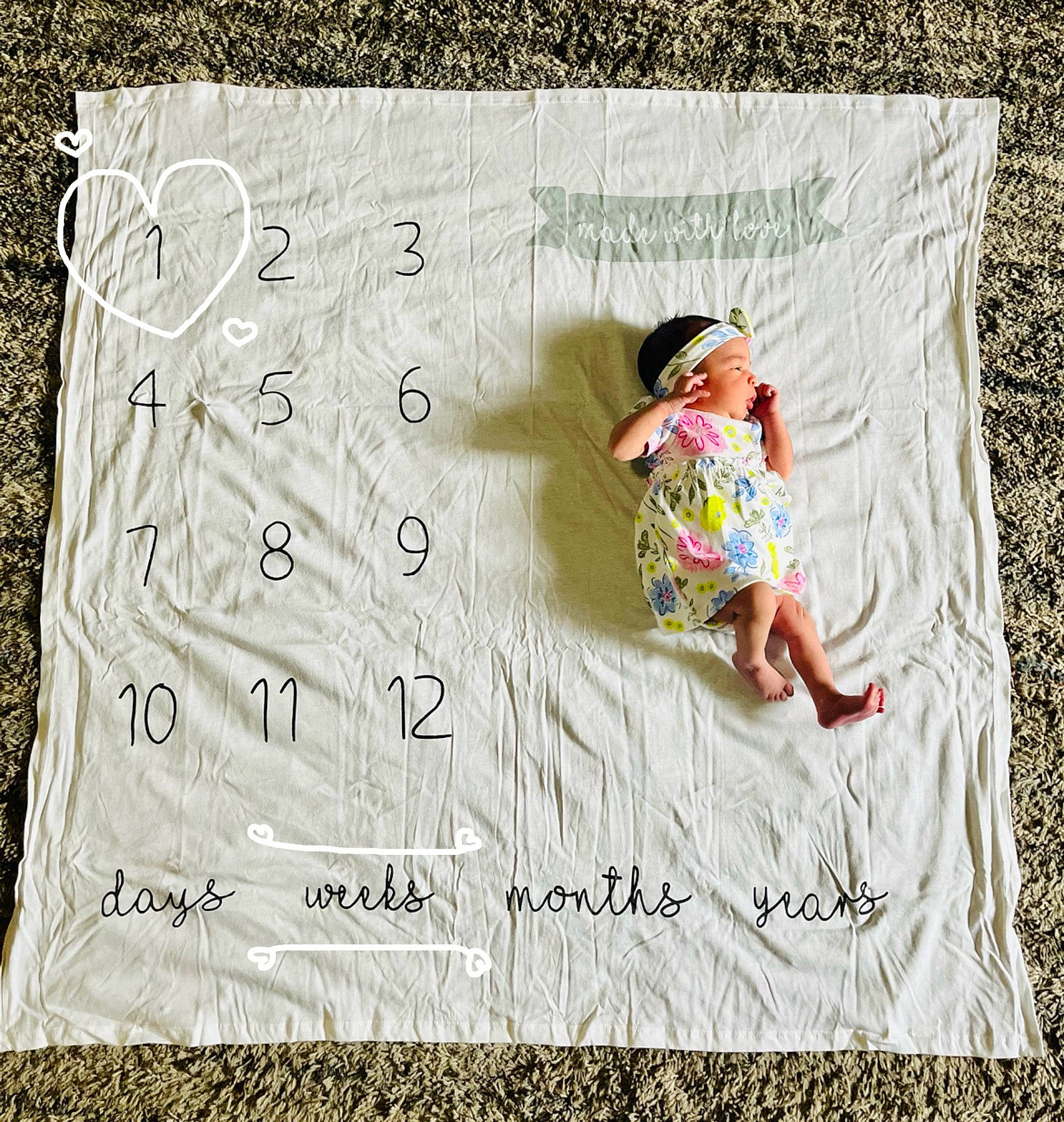 Genevieve is registered to the contest to win money with this photo: art, baby, baby_toddler_clothing, child, circle, font, grass, happy, illustration, linens, paper, paper_product, pattern, people_in_nature, person, rectangle, sleeve, t_shirt, toddler, wood