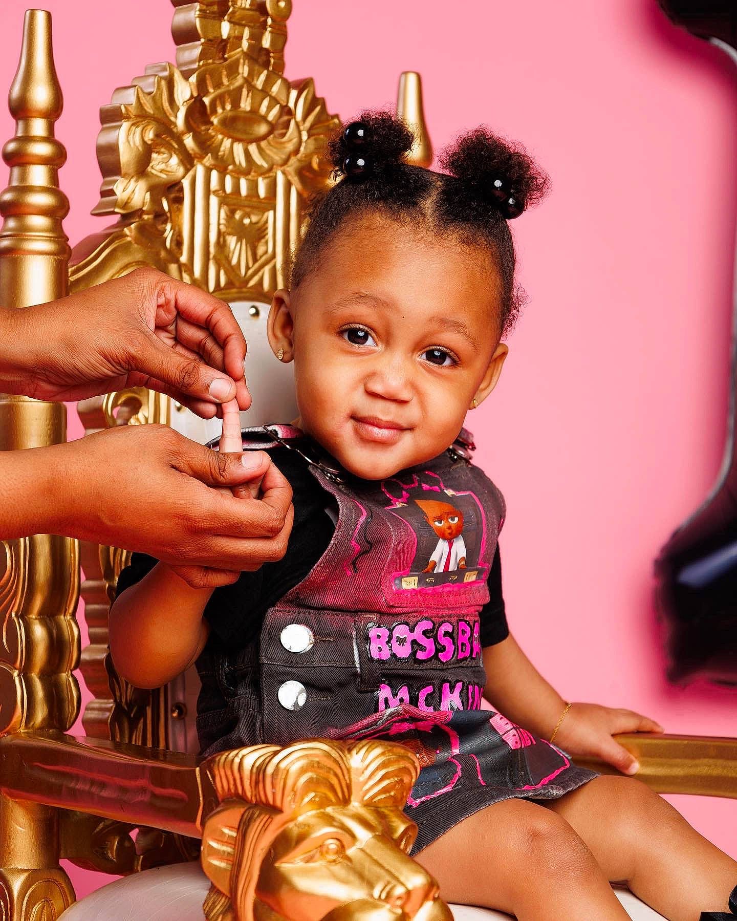 Mckenzie is registered to the contest to win money with this photo: arm, baby_toddler_clothing, black_hair, cheek, child, eyelash, facial_expression, finger, fun, gesture, hair, happy, organ, person, photograph, pink, skin, sleeve, smile, thigh