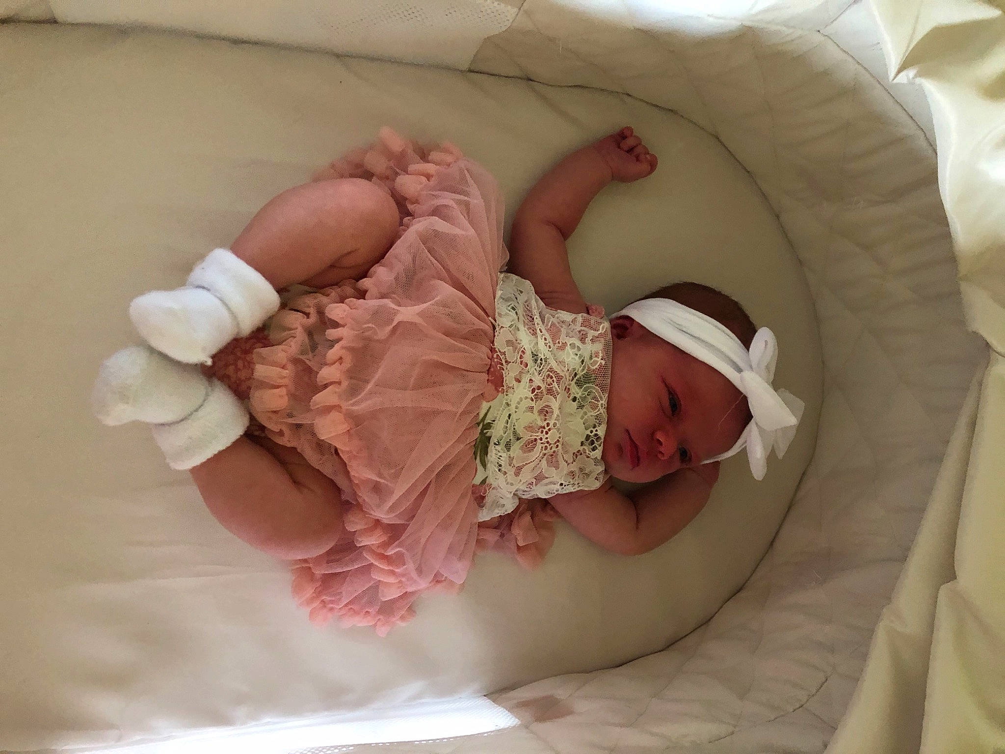 Brixley is registered to the contest to win money with this photo: baby, baby_products, baby_safety, baby_sleeping, baby_toddler_clothing, bedding, bedtime, child, comfort, headgear, headwear, human_body, infant_bed, leg, linens, person, pink, product, room, skin