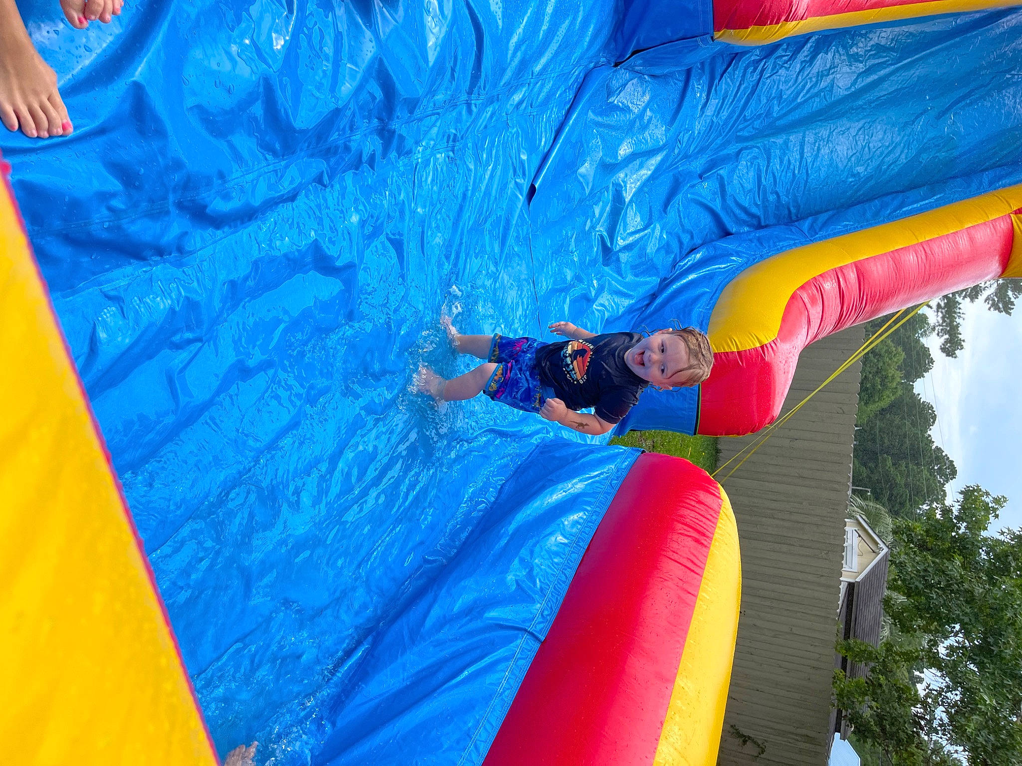 Jaxson joined the competition — help win amazing prizes! aqua, azure, blue, bounce_house, child, chute, electric_blue, event, fun, inflatable, leisure, outdoor_play_equipment, paint, person, play, playground, pole, recreation, tree, water