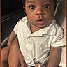 Dakota Haile joined the competition — help win amazing prizes! baby, infant, child, portrait, sitting, car_seat, seat_belt, harness, white_outfit, collar, wide_eyes, looking_at_camera, indoors, vehicle, close_up, face, hands, legs, sticker, safe