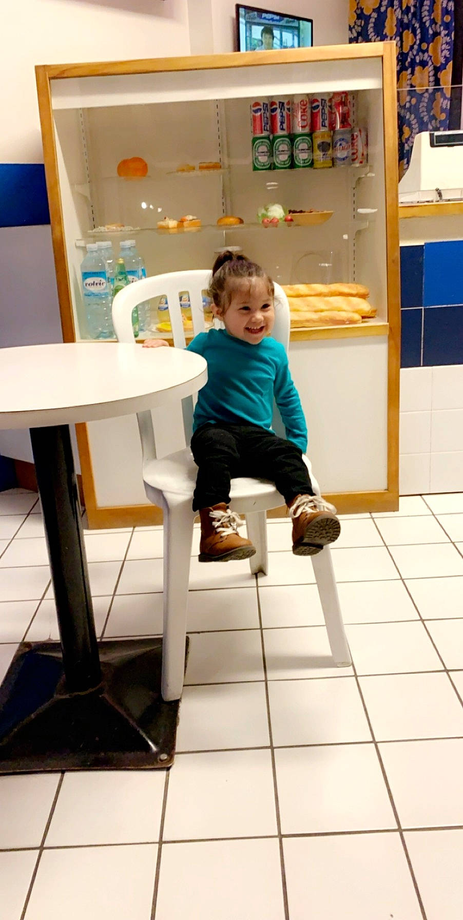 Xiomara joined the competition — help win amazing prizes! bar_stool, chair, child, floor, flooring, furniture, joy, person, play, sitting, stool, table, tile, toddler