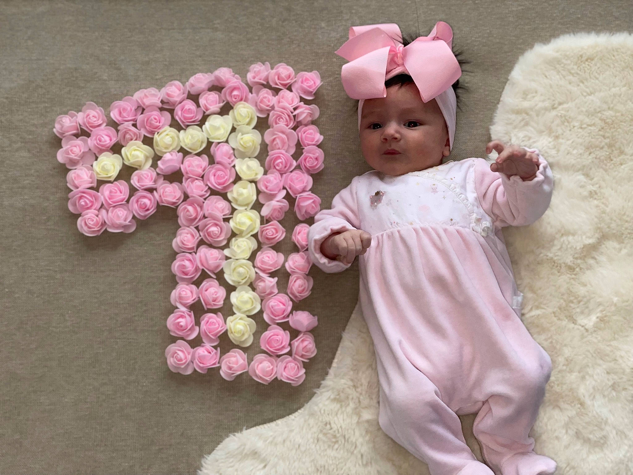 Aliyah participe au concours pour gagner de l'argent avec cette photo : baby, baby_toddler_clothing, child, costume_hat, cut_flowers, fun, fur, happy, headwear, magenta, person, petal, pink, plant, plush, stuffed_toy, sweetness, textile, toddler