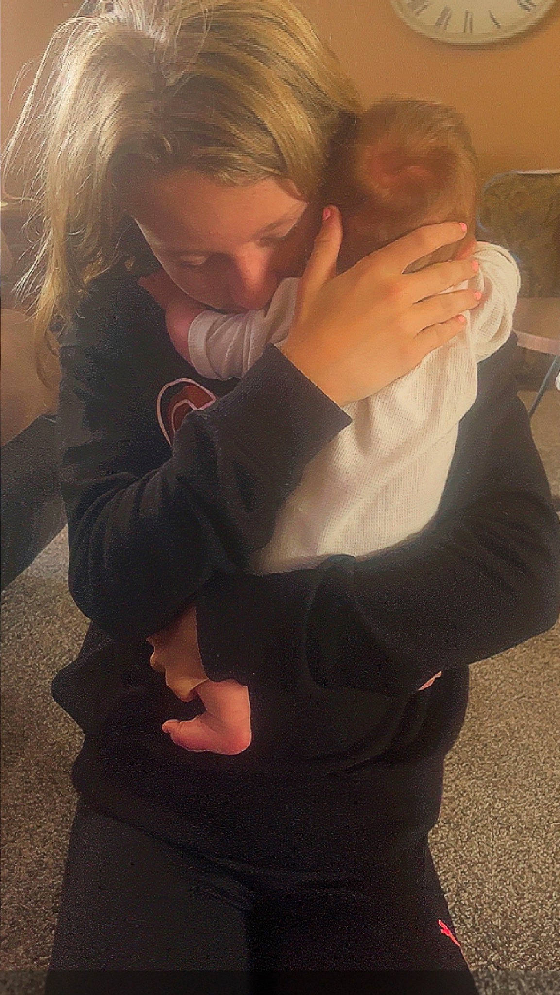 Atlas is registered to the contest to win money with this photo: arm, blond, child, comfort, elbow, finger, flash_photography, flooring, fun, gesture, hairstyle, hand, happy, head, hug, joint, person, sitting, thumb, toddler