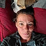 animal, bond, bulldog, casual, closeup, comfort, dog, face, gray_shirt, head, human, indoor, lying_down, pet, pillow, portrait, red_pillow, relaxed, resting, woman