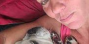 Cheese is registered to the contest to win money with this photo: animal, bulldog, casual, closeup, companion, couch, dog, face, friendship, happy, head, indoor, love, pet, pillow, portrait, relaxed, skin, snuggling, woman