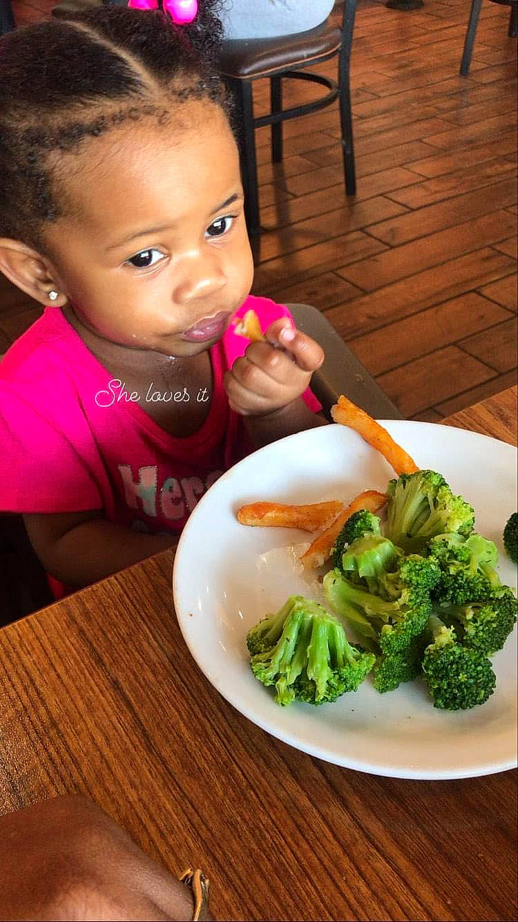 Journey is registered to the contest to win money with this photo: broccoflower, broccoli, chair, cuisine, dish, dishware, food, food_craving, ingredient, leaf_vegetable, natural_foods, person, plate, produce, recipe, sharing, table, tableware, toddler, vegetable