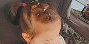Sasha joined the competition — help win amazing prizes! child, girl, hair_ties, confetti, chair, outdoor, grass, cooler, camping, shirt, patterned_clothing, sitting, looking_down, young_child, daylight, pigtails, relaxing, fabric, person, nature