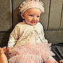 baby, child, girl, tutu, headband, pink, smile, sitting, cushion, cardigan, clothing, footwear, happy, portrait, indoor, person, cute, hand, soft, young