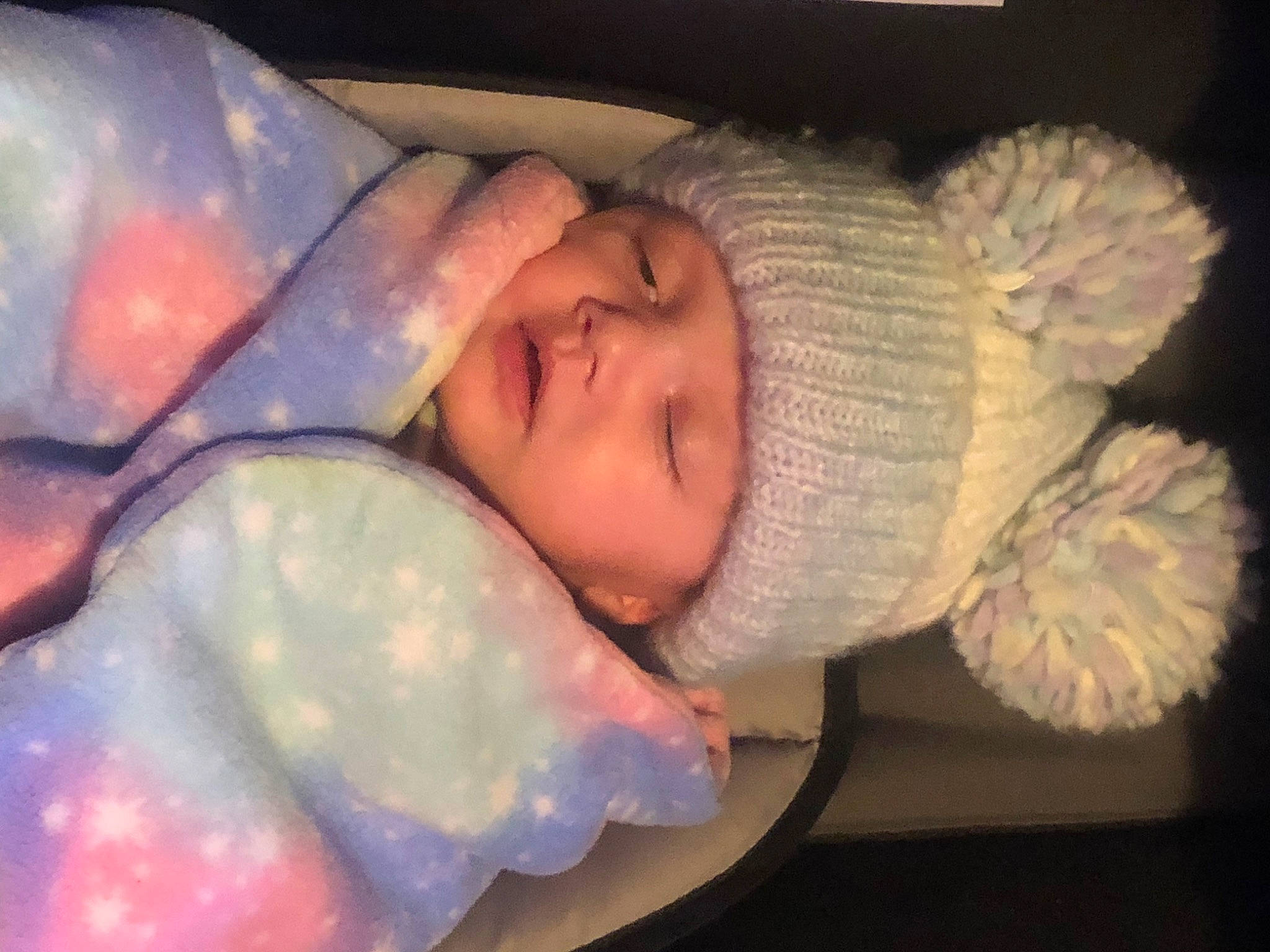 Izabella is registered to the contest to win money with this photo: baby, baby_products, baby_toddler_clothing, bedtime, cheek, child, comfort, eye, eyebrow, finger, fur, headwear, knit_cap, linens, nap, nose, person, petal, sleep, smile